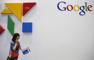 A woman walks past a logo of Google at the Global Mobile Internet Conference (GMIC) 2015 in Beijing, China, April 28, 2015. REUTERS/Kim Kyung-Hoon  - RTX1ALF0